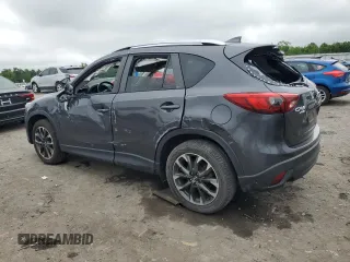 2016 Mazda CX-5 Grand Touring z VIN JM3KE4DY5G0741800, wystawiony jako Copart lot #58565455 z przebiegiem 33 675 mil mil oraz Szkoda całkowita • Salvage title. Historia ofert i sprzedaży dostępna na DreamBid. Obrazek 2.