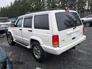 2000 Jeep Cherokee Classic with VIN 1J4FF58S4YL136213, listed as a IAAI auction lot 41227447 with 327,570 mi miles. Bid and sale history available at carsss.com. Image 3.