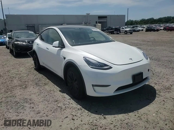 2022 Tesla Model Y Long Range z VIN 7SAYGDEE9NF455614, wystawiony jako Copart lot #57612985 z przebiegiem 22 101 mil mil oraz Szkoda całkowita • Salvage title. Historia ofert i sprzedaży dostępna na DreamBid. Obrazek 13.
