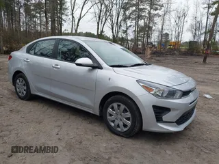 2023 Kia Rio S z VIN 3KPA24AD6PE594344, wystawiony jako IAAI lot #41510667 z przebiegiem 19 960 mil mil oraz . Historia ofert i sprzedaży dostępna na DreamBid. Obrazek 1.