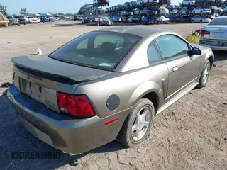 2001 Ford Mustang Standard with VIN 1FAFP40461F264327, listed as a IAAI auction lot 42002990 with 316,107 mi miles. Bid and sale history available at carsss.com. Image 4.
