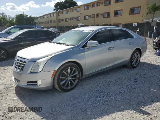 2013 Cadillac XTS Luxury z VIN 2G61P5S33D9171411, wystawiony jako Copart lot #67171235 z przebiegiem 117 062 mil mil oraz Czysty tytuł • Clean title. Historia ofert i sprzedaży dostępna na DreamBid. Obrazek 1.