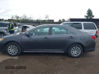 2014 Toyota Camry L with VIN 4T1BF1FK5EU403313, listed as a IAAI auction lot 42141338 with 185,925 mi miles and . Bid and sale history available at DreamBid. Image 14.