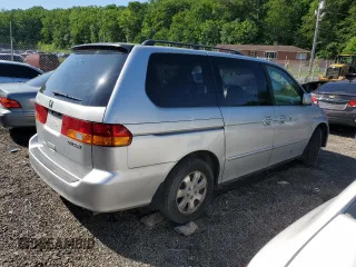 2003 Honda Odyssey EX-L z VIN 5FNRL18903B007639, wystawiony jako Copart lot #57230975 z przebiegiem 189 235 mil mil oraz Szkoda całkowita • Salvage title. Historia ofert i sprzedaży dostępna na DreamBid. Obrazek 3.