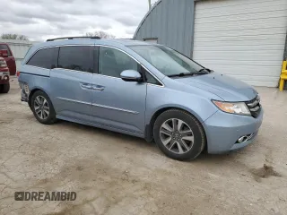 2014 Honda Odyssey Touring with VIN 5FNRL5H90EB007182, listed as a Copart auction lot 51152775 with 152,483 mi miles and Salvage title. Bid and sale history available at DreamBid. Image 4.