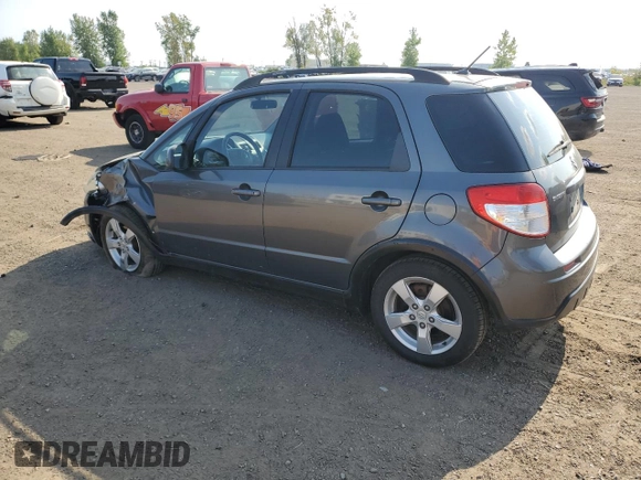 2010 Suzuki SX4 with VIN JS2YB5A24A6300249, listed as a Copart auction lot 71565394 with 291,886 mi miles and Salvage Title. Bid and sale history available at DreamBid. Image 2.