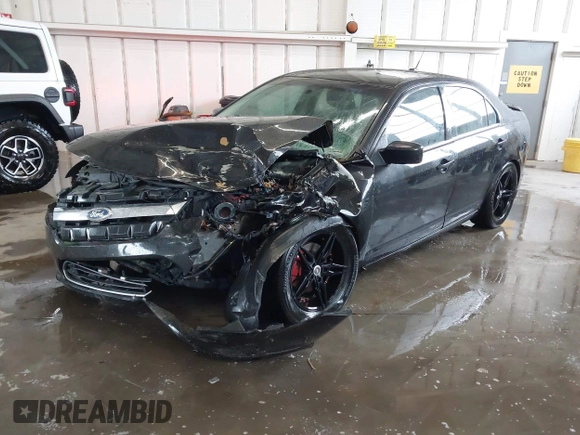 2012 Ford Fusion SE z VIN 3FAHP0HA5CR403929, wystawiony jako IAAI lot #42353429 z przebiegiem 208 668 mil mil oraz . Historia ofert i sprzedaży dostępna na DreamBid. Obrazek 18.