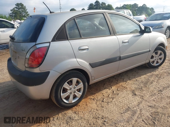 2009 Kia Rio LX with VIN KNADE243896483683, listed as a IAAI auction lot 42061404 with 88,614 mi miles. Bid and sale history available at carsss.com. Image 4.