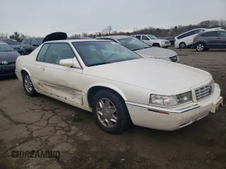 1999 Cadillac Eldorado z VIN 1G6EL12Y5XU600699, wystawiony jako Copart lot #88164505 z przebiegiem 140 075 mil mil oraz Szkoda całkowita • Salvage title. Historia ofert i sprzedaży dostępna na DreamBid. Obrazek 4.