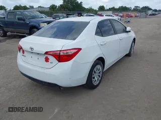 2019 Toyota Corolla L with VIN 5YFBURHE7KP908794, listed as a IAAI auction lot 38524964 with 65,069 mi miles. Bid and sale history available at carsss.com. Image 4.