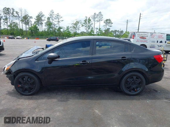 2014 Kia Rio LX with VIN KNADM4A33E6335499, listed as a IAAI auction lot 42123085 with 148,146 mi miles and . Bid and sale history available at DreamBid. Image 14.