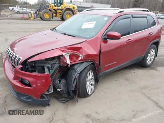 2015 Jeep Cherokee Latitude with VIN 1C4PJMCS6FW594812, listed as a IAAI auction lot 41709068 with 125,232 mi miles. Bid and sale history available at carsss.com. Image 2.