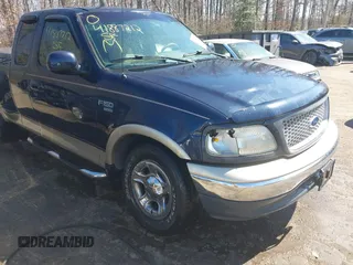 1999 Ford F-150 XL with VIN 2FTRX07L3XCA60067, listed as a IAAI auction lot 41887212 with 176,034 mi miles. Bid and sale history available at carsss.com. Image 6.
