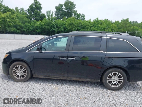 2012 Honda Odyssey EX-L with VIN 5FNRL5H66CB095996, listed as a IAAI auction lot 42446499 with 198,016 mi miles and . Bid and sale history available at DreamBid. Image 14.