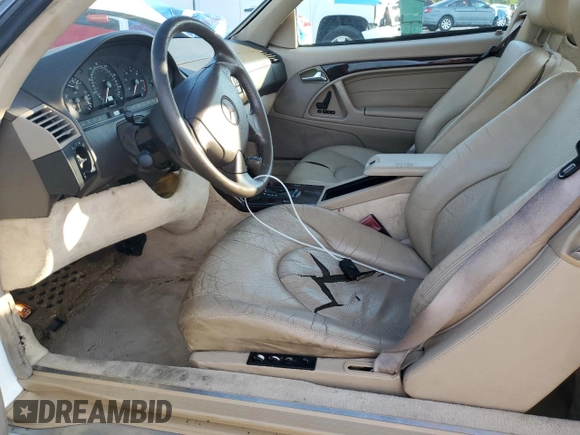 1997 Mercedes-Benz SL 500 with VIN WDBFA67FXVF149930, listed as a Copart auction lot 64749525 with 88,523 mi miles and Salvage title. Bid and sale history available at DreamBid. Image 7.