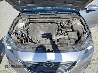 2015 Mazda 3 i Grand Touring z VIN JM1BM1M70F1260802, wystawiony jako Copart lot #60662705 z przebiegiem 89 974 mil mil oraz Szkoda całkowita • Salvage title. Historia ofert i sprzedaży dostępna na DreamBid. Obrazek 11.