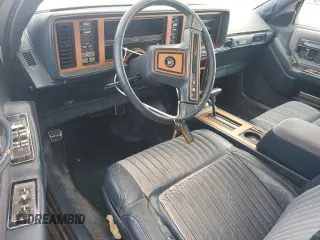 1987 Cadillac Seville z VIN 1G6KS518XHU812739, wystawiony jako Copart lot #79308574 z przebiegiem Nie podano mil oraz Szkoda całkowita • Salvage title. Historia ofert i sprzedaży dostępna na DreamBid. Obrazek 8.
