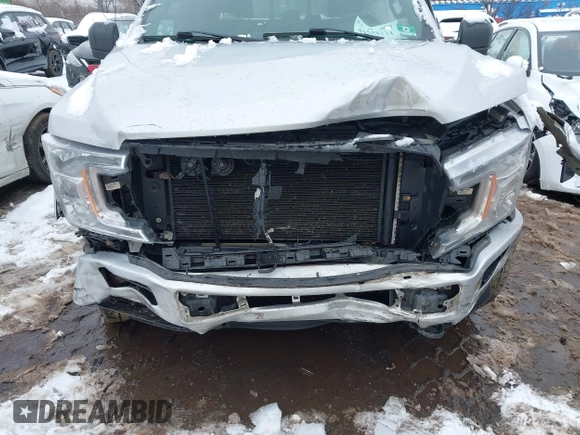 2018 Ford F-150 XL with VIN 1FTFW1E54JKC59793, listed as a IAAI auction lot 41558134 with 217,831 mi miles. Bid and sale history available at carsss.com. Image 6.