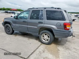 2003 Jeep Grand Cherokee Laredo with VIN 1J4GW48SX3C569087, listed as a Copart auction lot 55941035 with Not provided miles and Salvage title. Bid and sale history available at DreamBid. Image 2.