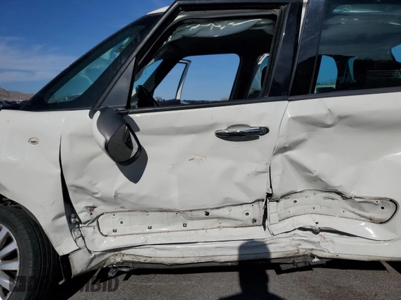 2014 FIAT 500L Easy with VIN ZFBCFABH8EZ018871, listed as a Copart auction lot 52770705 with 198,942 mi miles and Salvage Title. Bid and sale history available at DreamBid. Image 7.