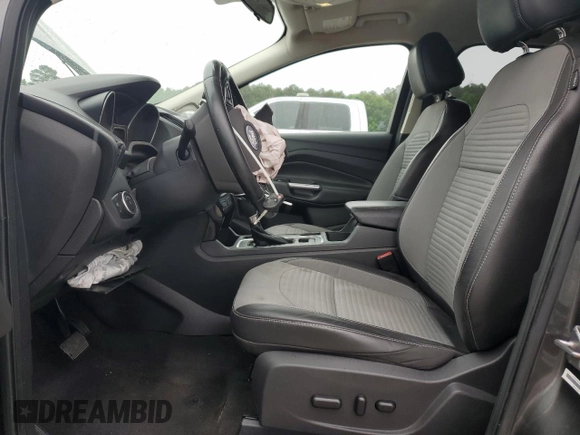 2017 Ford Escape SE z VIN 1FMCU9GD1HUB35003, wystawiony jako Copart lot #56502385 z przebiegiem 74 409 mil mil oraz Szkoda całkowita • Salvage title. Historia ofert i sprzedaży dostępna na DreamBid. Obrazek 7.