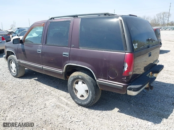 1997 Chevrolet Tahoe with VIN 1GNEK13R5VJ386701, listed as a IAAI auction lot 42046195 with 241,735 mi miles. Bid and sale history available at carsss.com. Image 3.