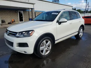 2012 Volkswagen Touareg Sport with VIN WVGFK9BP1CD000200, listed as a Copart auction lot 61927255 with 162,643 mi miles and Non repairable. Bid and sale history available at DreamBid. Image 1.