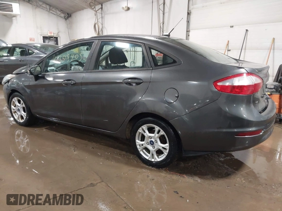 2015 Ford Fiesta SE with VIN 3FADP4BJ9FM164093, listed as a IAAI auction lot 41308905 with 75,839 mi miles. Bid and sale history available at carsss.com. Image 3.