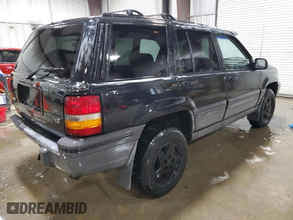 1995 Jeep Grand Cherokee Laredo with VIN 1J4GZ58Y5SC565187, listed as a Copart auction lot 45179985 with 122,863 mi miles and Salvage Title. Bid and sale history available at carsss.com. Image 3.