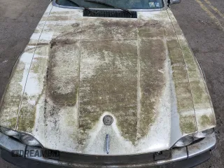 1989 Jaguar XJS z VIN SAJNY584XKC161154, wystawiony jako Copart lot #70912984 z przebiegiem 65 188 mil mil oraz Czysty tytuł • Clean title. Historia ofert i sprzedaży dostępna na DreamBid. Obrazek 11.