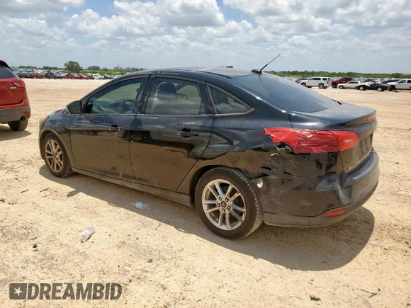 2016 Ford Focus SE with VIN 1FADP3F23GL271205, listed as a Copart auction lot 59395855 with 202,504 mi miles and Salvage title. Bid and sale history available at DreamBid. Image 2.