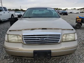 1999 Ford Crown Victoria z VIN 2FAFP73W4XX137040, wystawiony jako Copart lot #83741244 z przebiegiem 142 901 mil mil oraz Szkoda całkowita • Salvage title. Historia ofert i sprzedaży dostępna na DreamBid. Obrazek 5.
