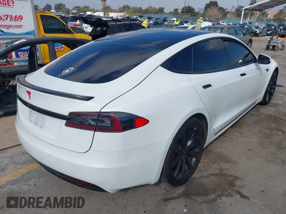 2016 Tesla Model S 90D with VIN 5YJSA1E27GF153525, listed as a IAAI auction lot 41539221 with 145,771 mi miles and . Bid and sale history available at DreamBid. Image 4.