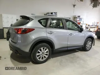 2014 Mazda CX-5 Sport with VIN JM3KE4BE4E0419882, listed as a Copart auction lot 53896815 with 127,428 mi miles and Salvage Title. Bid and sale history available at carsss.com. Image 3.