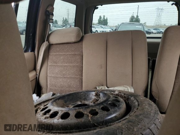 1999 Ford Explorer XLT with VIN 1FMZU34E6XZC14009, listed as a Copart auction lot 55251525 with 253,681 mi miles and Salvage title. Bid and sale history available at DreamBid. Image 10.