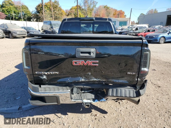 2016 GMC Canyon 4WD SLT with VIN 1GTP6DE11G1357147, listed as a Copart auction lot 77835344 with 106,890 mi miles and Salvage Title. Bid and sale history available at carsss.com. Image 6.