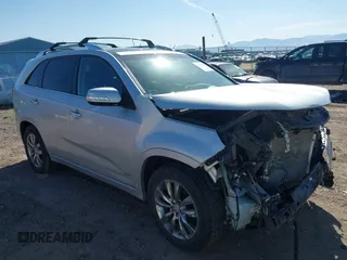 2012 Kia Sorento SX z VIN 5XYKWDA20CG281732, wystawiony jako IAAI lot #42033914 z przebiegiem 108 688 mil mil oraz . Historia ofert i sprzedaży dostępna na DreamBid. Obrazek 1.