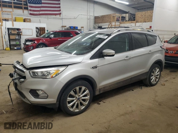 2017 Ford Escape Titanium with VIN 1FMCU0JD6HUE70200, listed as a Copart auction lot 49141595 with 92,159 mi miles and Salvage Title. Bid and sale history available at DreamBid. Image 1.