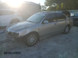 1999 Infiniti G20 z VIN JNKCP11A7XT020372, wystawiony jako Copart lot #73639514 z przebiegiem 174 467 mil mil oraz Szkody całkowita. Historia ofert i sprzedaży dostępna na DreamBid. Obrazek 1.