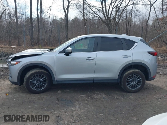 2021 Mazda CX-5 Touring with VIN JM3KFBCM9M1329806, listed as a IAAI auction lot 41825123 with 59,300 mi miles. Bid and sale history available at carsss.com. Image 14.