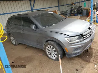 2018 Volkswagen Tiguan S with VIN 3VV1B7AXXJM054778, listed as a Copart auction lot 61294795 with 87,330 mi miles and Salvage title. Bid and sale history available at DreamBid. Image 4.