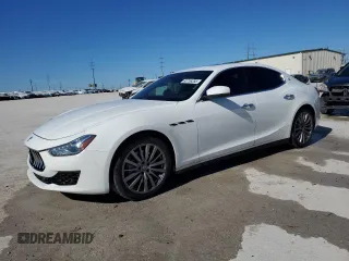 2018 Maserati Ghibli with VIN ZAM57XSA4J1299855, listed as a Copart auction lot 88756355 with 83,721 mi miles and Salvage Title. Bid and sale history available at carsss.com. Image 1.