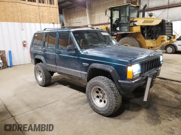 1996 Jeep Cherokee Sport with VIN 1J4FJ68S1TL226495, listed as a Copart auction lot 58587685 with 205,397 mi miles and Salvage title. Bid and sale history available at DreamBid. Image 4.