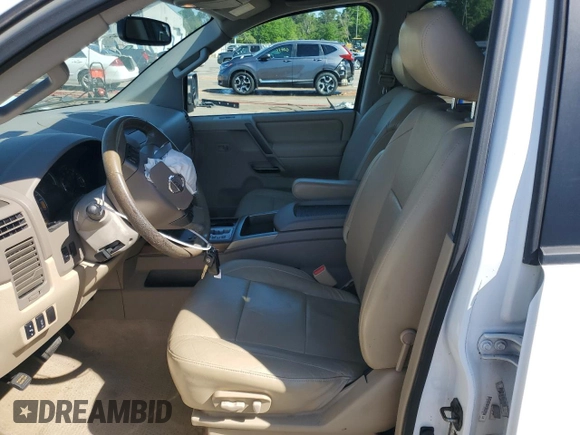 2012 Nissan Titan SV with VIN 1N6BA0ED9CN302103, listed as a Copart auction lot 52678495 with 214,564 mi miles and Salvage title. Bid and sale history available at DreamBid. Image 7.