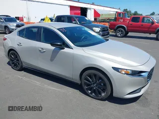 2024 Mazda 3 S Select Sport with VIN 3MZBPABM9RM427906, listed as a IAAI auction lot 42533590 with 13,512 mi miles and . Bid and sale history available at DreamBid. Image 1.