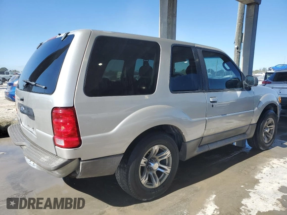 2003 Ford Explorer Sport XLS z VIN 1FMYU60E43UB05641, wystawiony jako Copart lot #87804375 z przebiegiem 130 434 mil mil oraz Szkody całkowita. Historia ofert i sprzedaży dostępna na DreamBid. Obrazek 3.