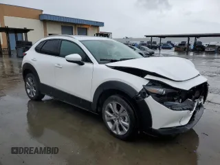 2021 Mazda CX-30 Premium with VIN 3MVDMADM4MM217643, listed as a Copart auction lot 45041145 with 27,774 mi miles and Salvage title. Bid and sale history available at DreamBid. Image 4.