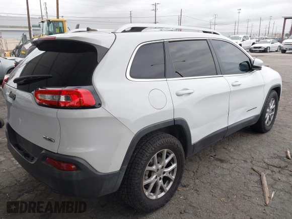 2015 Jeep Cherokee Latitude with VIN 1C4PJLCB5FW642701, listed as a IAAI auction lot 42063262 with 142,501 mi miles and . Bid and sale history available at carsss.com. Image 4.