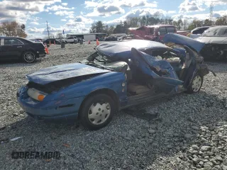 2000 Saturn SL z VIN 1G8ZG5281YZ256197, wystawiony jako Copart lot #80046594 z przebiegiem Nie podano mil oraz Szkody całkowita. Historia ofert i sprzedaży dostępna na DreamBid. Obrazek 1.