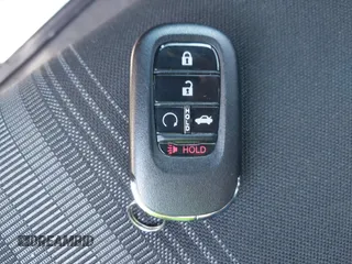 2023 Honda Civic Sport with VIN 2HGFE2F58PH557787, listed as a IAAI auction lot 42207827 with 51,885 mi miles and . Bid and sale history available at DreamBid. Image 11.